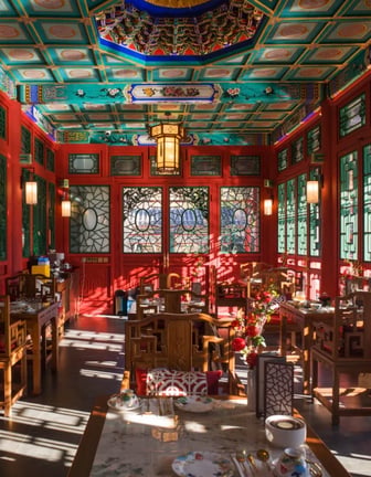 Prince Kung’s Mansion. Elegant traditional Chinese tea house interior with red walls.