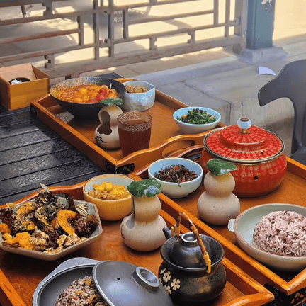 Imperial-style Beijing dishes with multi-grain rice and side dishes served at Na Jia Xiao Guan restaurant.