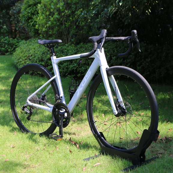 XDS AD350 road bike with disc brakes parked on a green grass lawn.