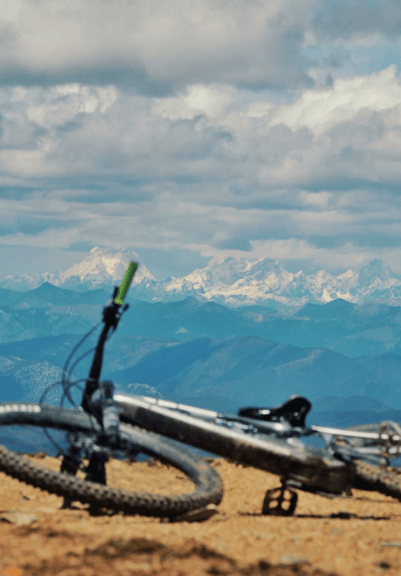 E-MTB rider on the rocky Ganheba enduro trail near Lijiang