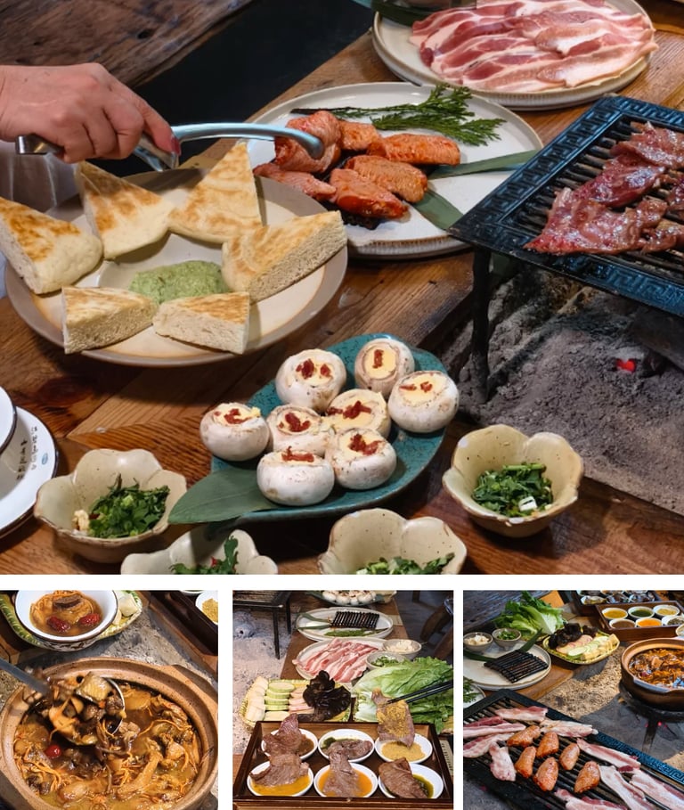 Table spread of traditional firepit dining featuring grilled meats, stuffed mushrooms, and hot pot.